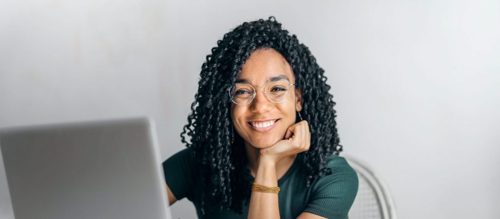 smiling woman at computer